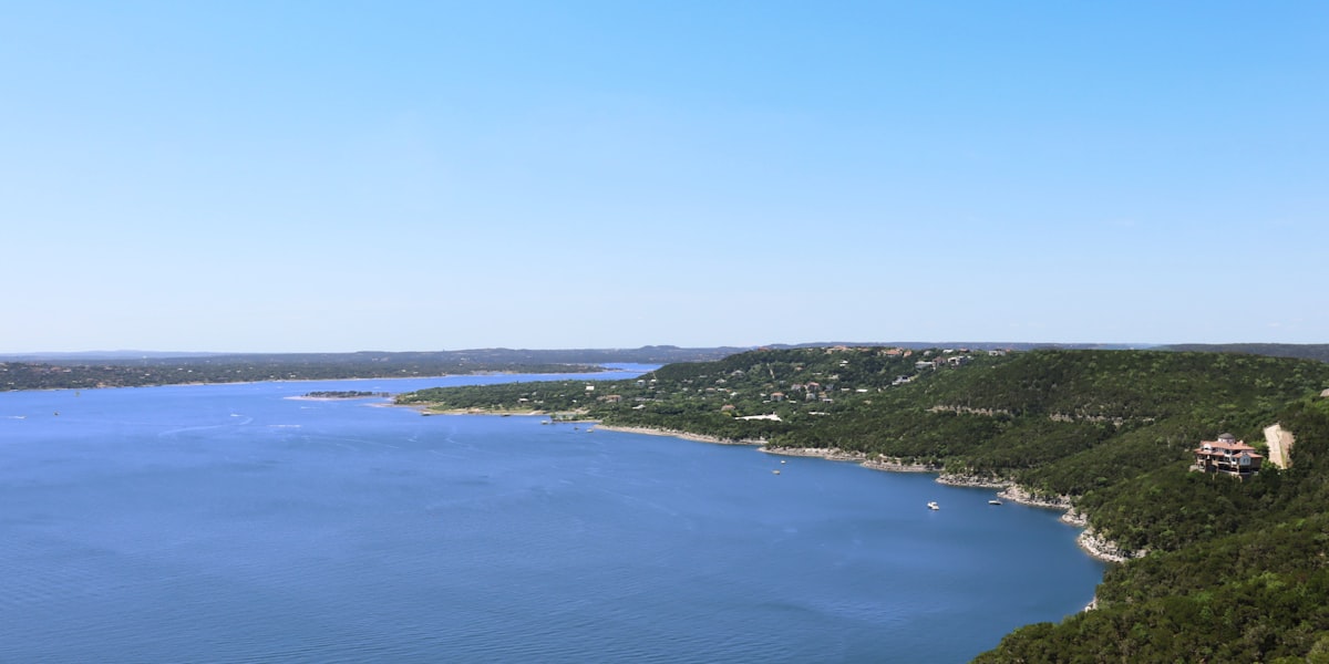 Aerial view of Lake Travis surrounded by Texas Hill Country greenery