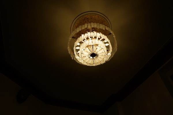Elegant chandelier light fixture professionally installed in a residential ceiling